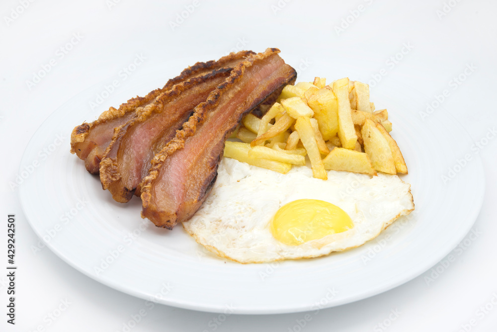 slice of bacon, egg and potatoes chips in white background slice of bacon, egg and potatoes chips in white background
