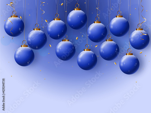 Background with blue Christmas balls and glitter