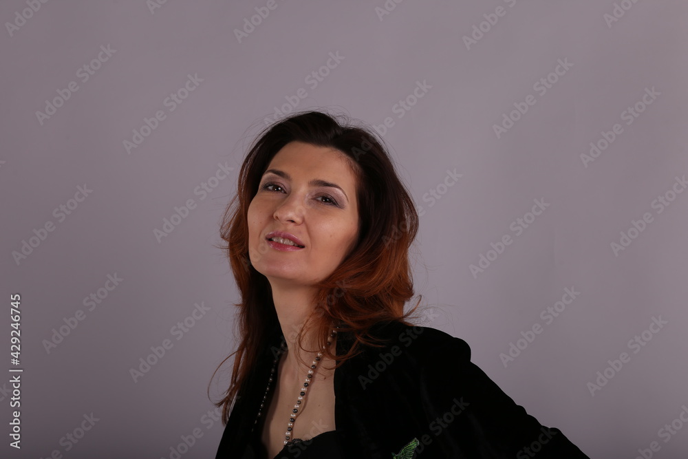 Studio portrait of elegant woman in black jacket Studio portrait of elegant woman in black jacket