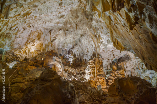Underground cave, amazing scene , view of stalactites and stalagmite underground , formation inside.