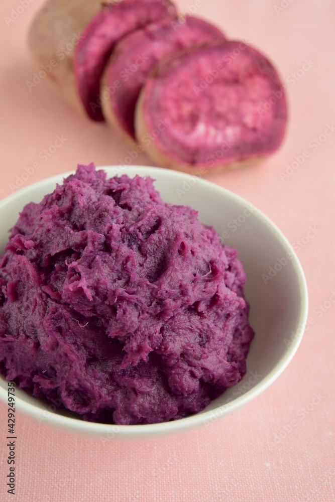 Mashed purple sweet potato in a bowl Mashed purple sweet potato in a bowl
