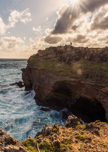 Woman on top of cliffside in Robberg Nature Reserve, South Africa. September 2019