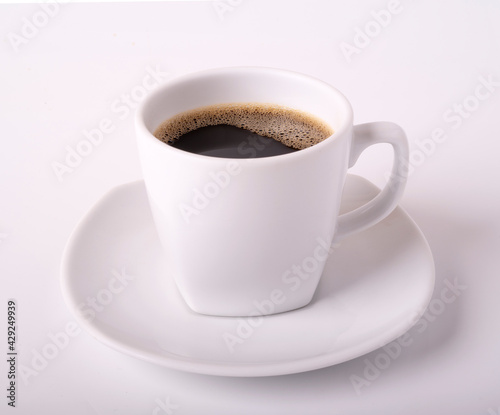black coffee and bubble in white mug isolated on background