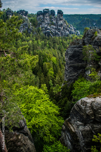 Saxon Switzerland is a unique natural wonder in Saxony, Germany. Sandstone cliffs in green valleys.