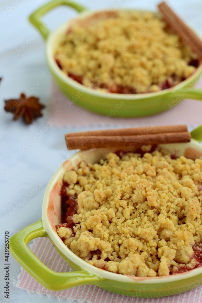 Plum crumble with spices on white background. Summer crispy fruit dessert. Tasty breakfast. Selective focus
Plum crumble with spices on white background. Summer crispy fruit dessert. Tasty breakfast. Selective focus