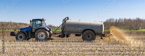Konstfotografi Tractor with slurry tanker fertilising in the field CP5140