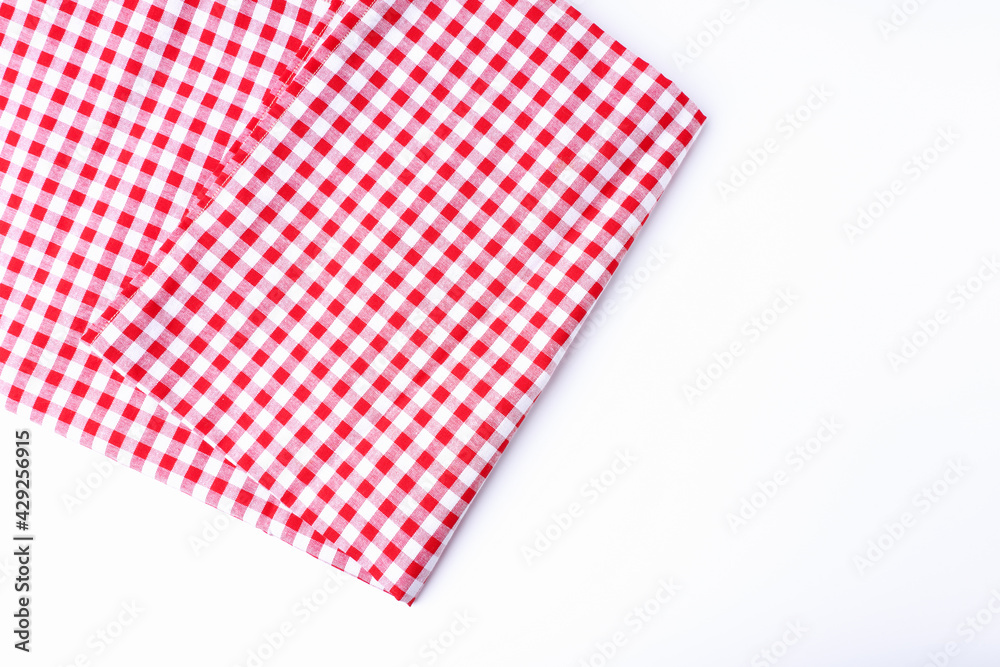 Tablecloth, red and white fabric checkered isolated on white background with copy space. Tablecloth, red and white fabric checkered isolated on white background with copy space.