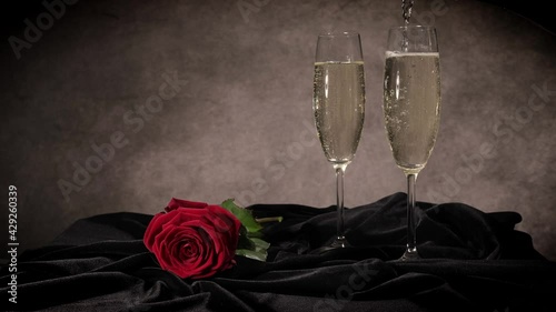 Red roses and glasses of Champagne - studio photography photo