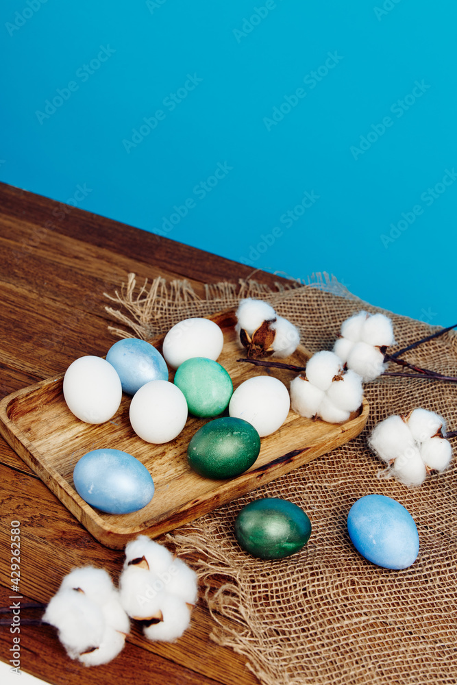 Obraz premium Easter church holiday colorful eggs on chalkboard and blue background