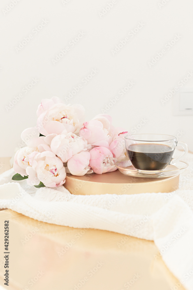Styled composition with pink tulips on gold background. Floral frame and white textile. Border top view. Styled composition with pink tulips on gold background. Floral frame and white textile. Border top view.