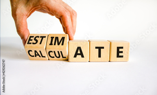 Estimate or calculate symbol. Businessman turns wooden cubes and changes the word 'calculate' to 'estimate'. Beautiful white background, copy space. Business, estimate or calculate concept.