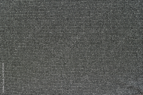 gray background from knitted fabric with lurex thread