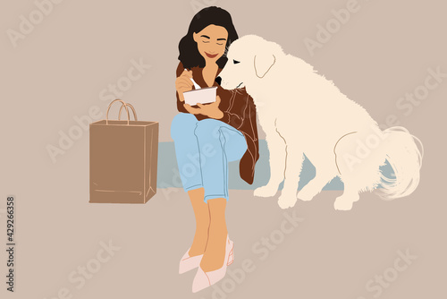 Pretty woman have outdoor lunch with her big white dog while sitting on the stairs. Shares food with a dog. Pet friendly and pet care concept. Animal lover. 