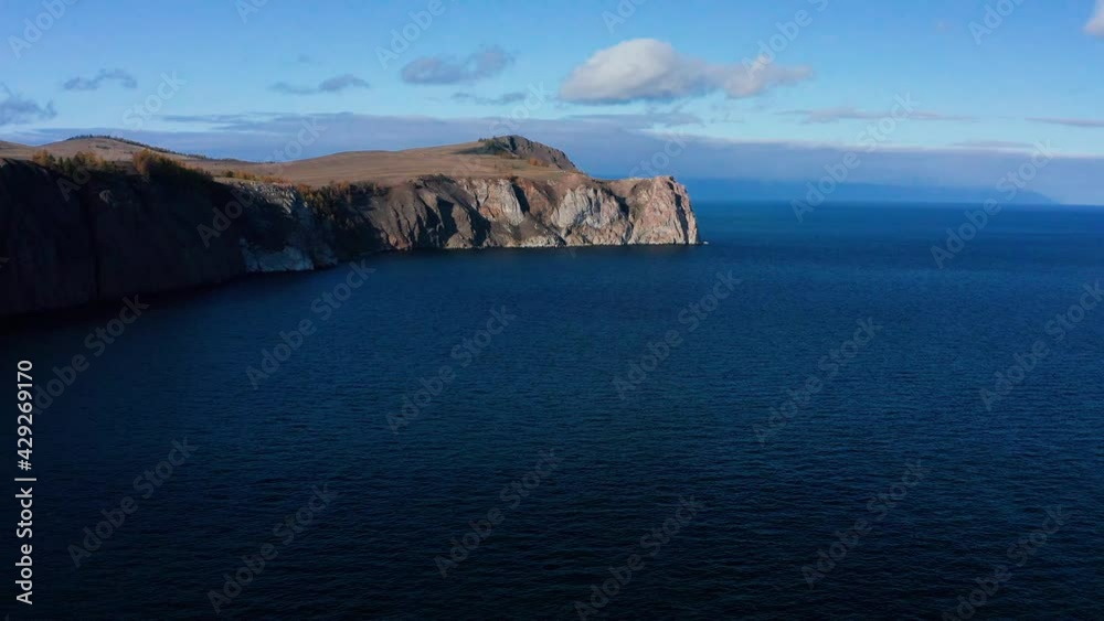 Lake Baikal in autumn. Olkhon Island. Amtakhorski bay and Shunte-Left cape. Aerial view. Lake Baikal in autumn. Olkhon Island. Amtakhorski bay and Shunte-Left cape. Aerial view.