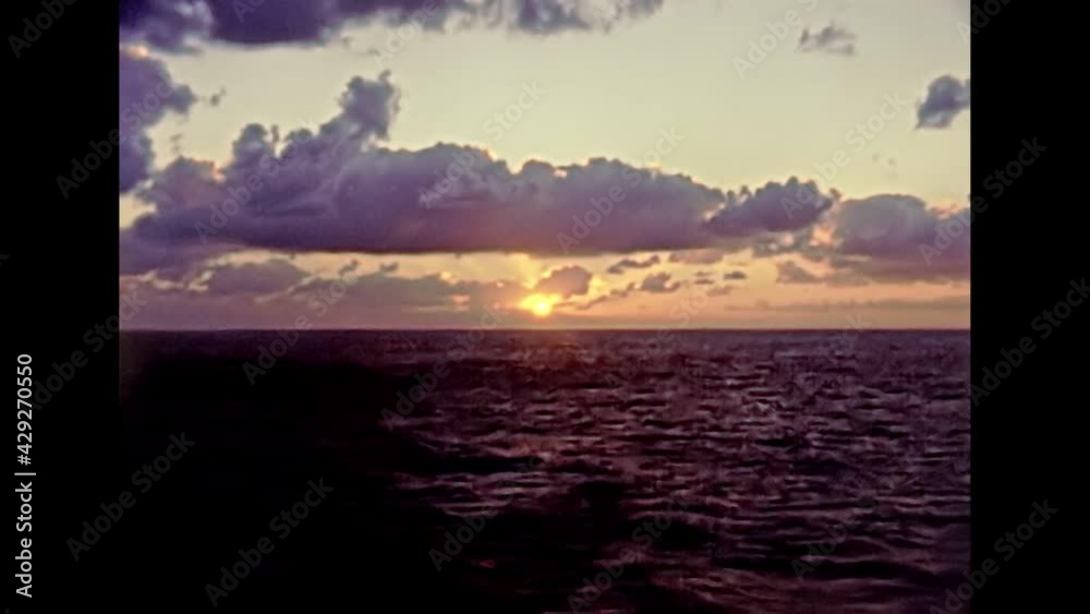 Touristic cruise by boat in Egypt, mediterranean sea at sunset. Historical archival of Egypt in 1980s.
