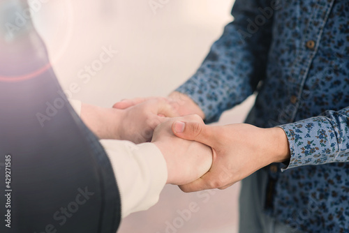 Young gay couple smiling happy and hugging at the city.