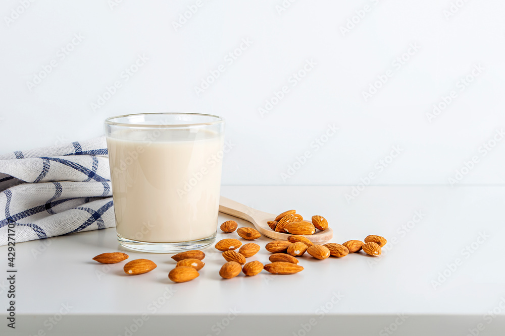 Cooked nuts vegetable drink. Almonds milk in glass. Homemade food concept. Plant based organic veggie milk, lactose free Cooked nuts vegetable drink. Almonds milk in glass. Homemade food concept. Plant based organic veggie milk, lactose free