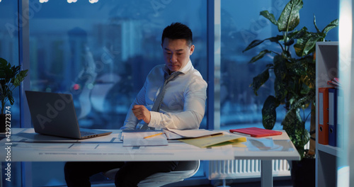 Photography Chinese adult businessman creator thinking over new project generating ideas looking outside window overworking in office department alone