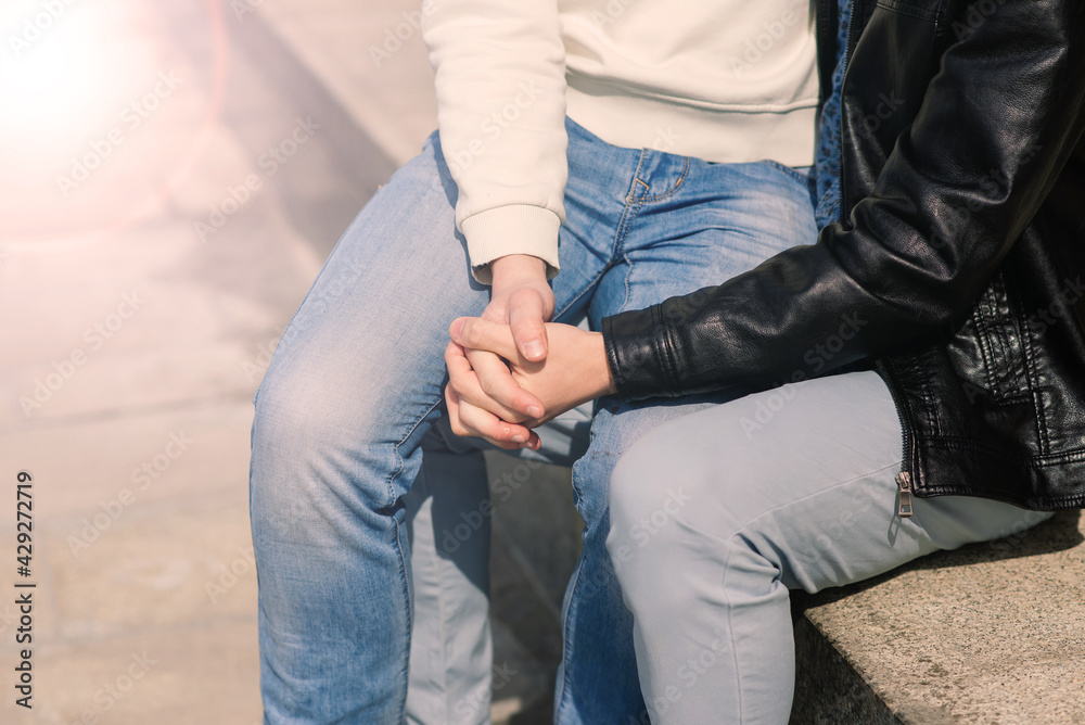 Young gay couple smiling happy and hugging at the city. Young gay couple smiling happy and hugging at the city.