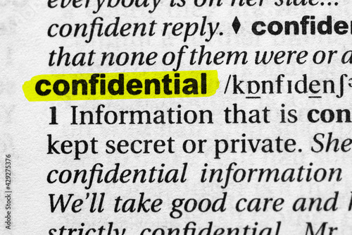 Highlighted word confidential concept and meaning. photo