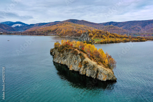 Lake Baikal in autumn. Cape Shamansky and Khamar-Daban ridge. Aerial view. photo