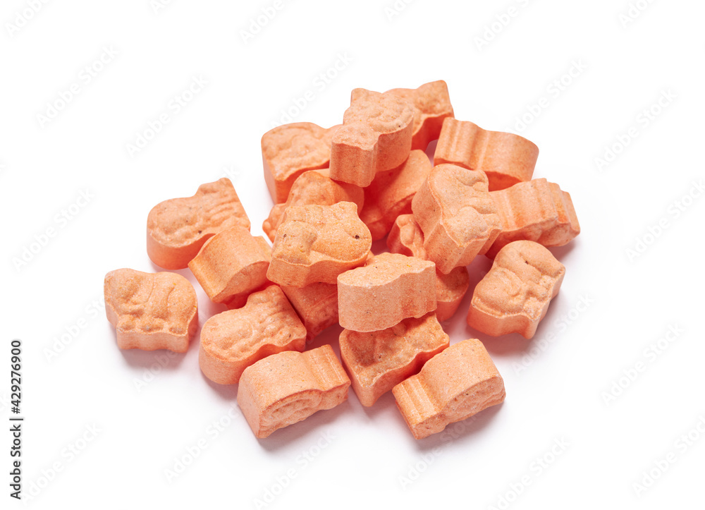 Orange animal shape vitamins for kids isolated on a white background with clipping path. Assorted animal shaped multivitamins for kids. Chewable pills Orange animal shape vitamins for kids isolated on a white background with clipping path. Assorted animal shaped multivitamins for kids. Chewable pills