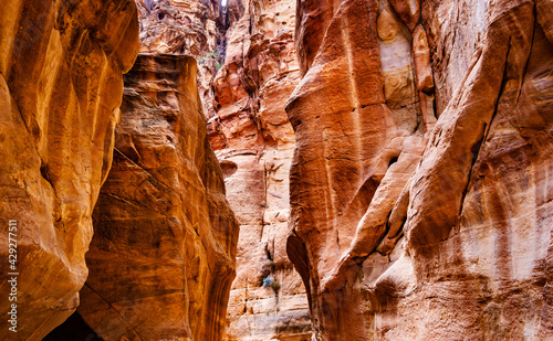 Canyon narrow path way between steep rocks  Petra  Jordan