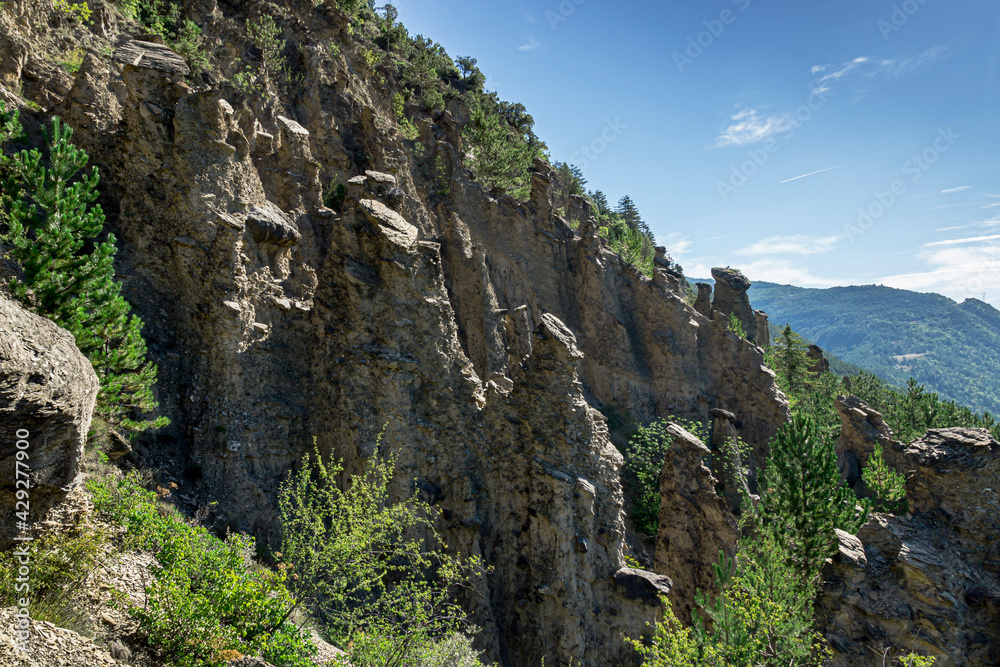 Astonishing  rock formations called bridesmaids with hair (Demoiselles coiffées) in Theus and Remollon french villages in Alps region.