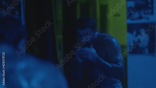 a man with a beard trains in the mountains and the gym