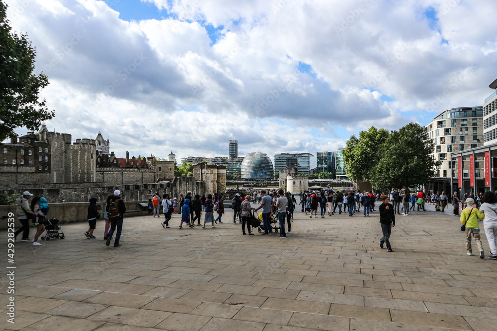London city waterfront crowded with people sightseeing around famous city landmarks and attractions