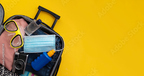 Canvas-taulu Suitcase packed for a summer vacation during the coronavirus global pandemic