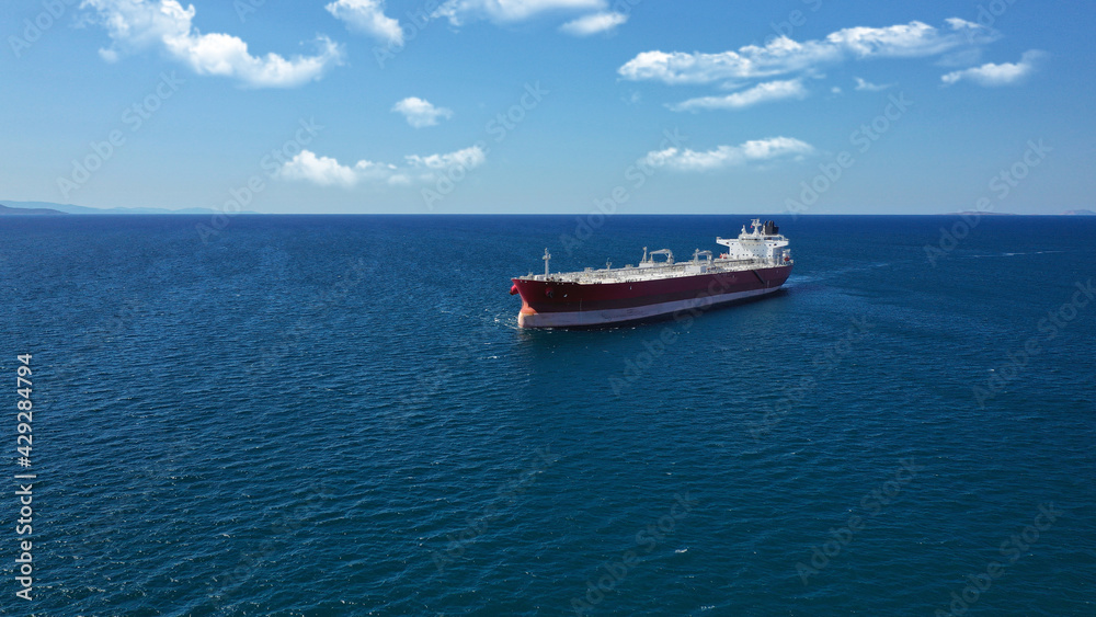 Aerial photo of industrial crude oil - fuel tanker ship cruising deep blue Mediterranean sea