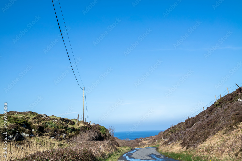 Utility Pole and lines for transmission of electricity and communication to dwellings in rural Ireland