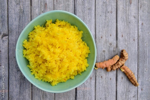 Nasi Kuning or Turmeric rice. Indonesian food  photo