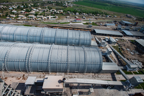 Standard Cement plant. Warehouse hangars panoramic view from top.