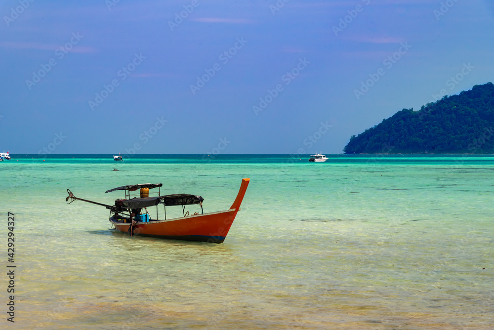 Thailand nature landscape. A long tail boat by the beach in Thailand
