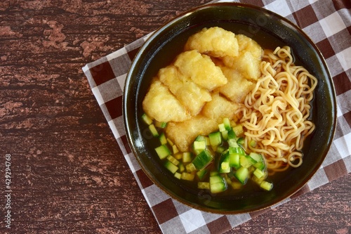 Pempek or mpek-mpek, popular savory fish cake dish from Palembang, South Sumatra, Indonesia. Served in sweet and sour sauce (kuah cuka) accompanied with noodles, cucumbers