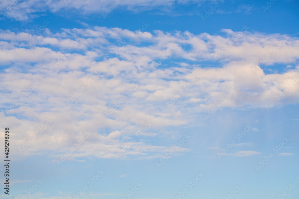 White clouds against the blue sky.