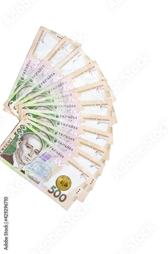 fans of 500 hryvnia bills (ukrainian money) and one coin isolated on white background with free space for your text. Money and financial concept