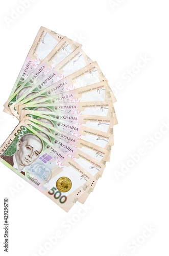 fans of 500 hryvnia bills (ukrainian money) and one coin  isolated on white background with free space for your text. Money and financial concept