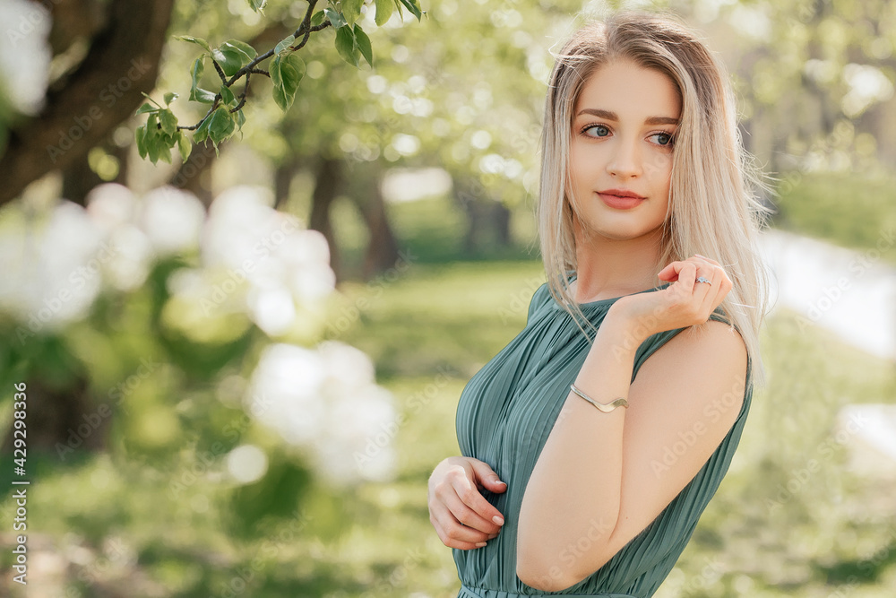 Portrait of beautiful woman in the flowering spring garden. Portrait of beautiful woman in the flowering spring garden.