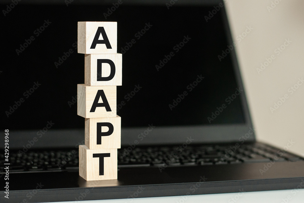 Ταπετσαρία adapt word made with building blocks on the black keyboard