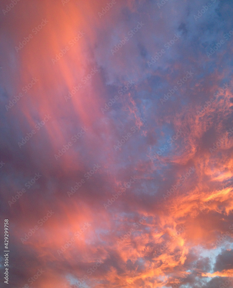 Fototapeta premium Fiery sunset with orange clouds