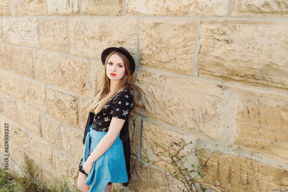 Stylish hipster woman traveler by the old bridge viaduct. Traveling, Europe, fashion, style concept