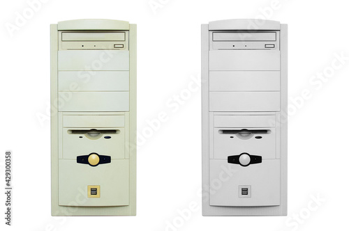 Outdated yellowed system unit of personal computer. White isolate. photo