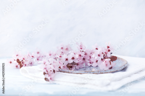 Spring flowers on bright wooden background. Close up. Copy space. 