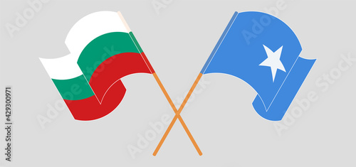 Crossed and waving flags of Bulgaria and Somalia