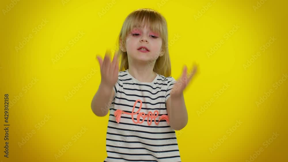Upset displeased little blonde teen child kid girl raising hands, indignantly asking reason of failure, misunderstanding concept isolated on yellow studio background. Childhood quarrel. Young children Upset displeased little blonde teen child kid girl raising hands, indignantly asking reason of failure, misunderstanding concept isolated on yellow studio background. Childhood quarrel. Young children