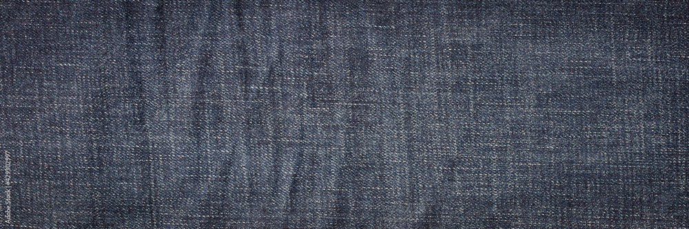 texture of dark blue jeans denim fabric background
texture of dark blue jeans denim fabric background