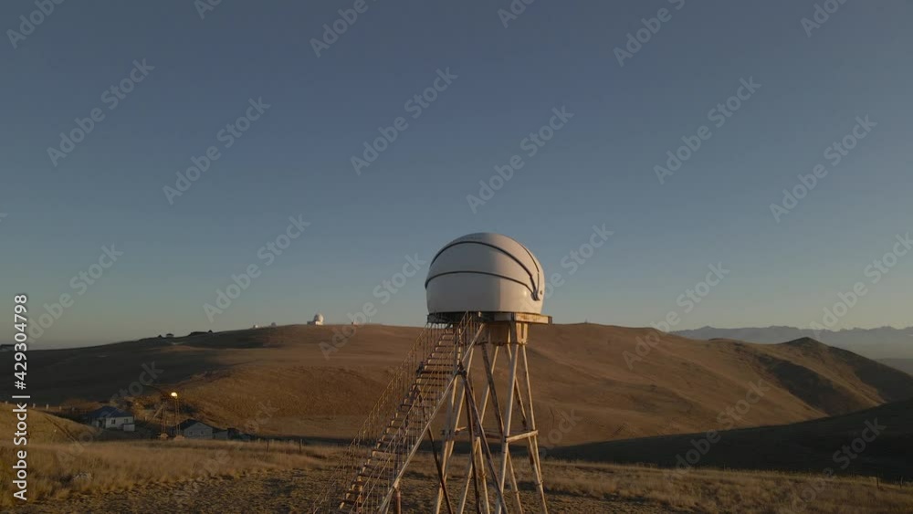 Old telescope in the Elbrus mountains at sunset. Location North Caucasus. Russia. Drone video. Old telescope in the Elbrus mountains at sunset. Location North Caucasus. Russia. Drone video.
